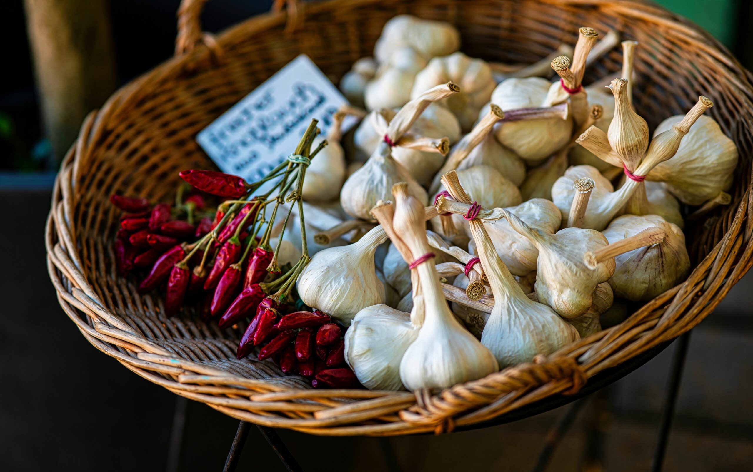 Red chili and garlic in basket displayed at famous marketplace V